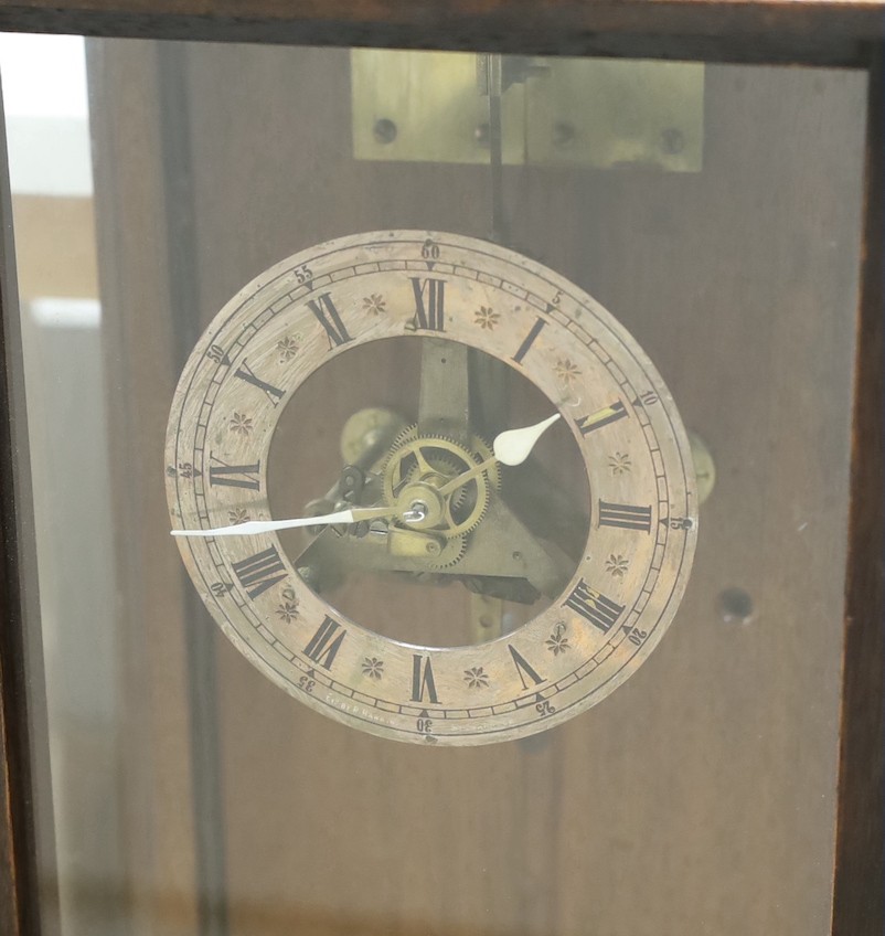 Electric wall timepiece, 99 cms high.